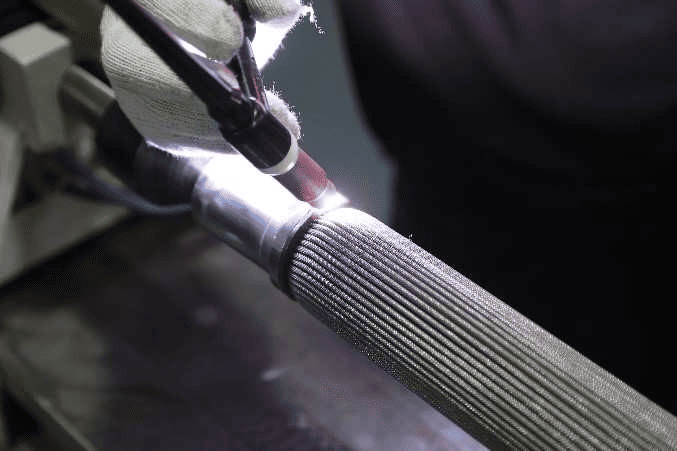 Welding an end cap to a sintered metal filter element